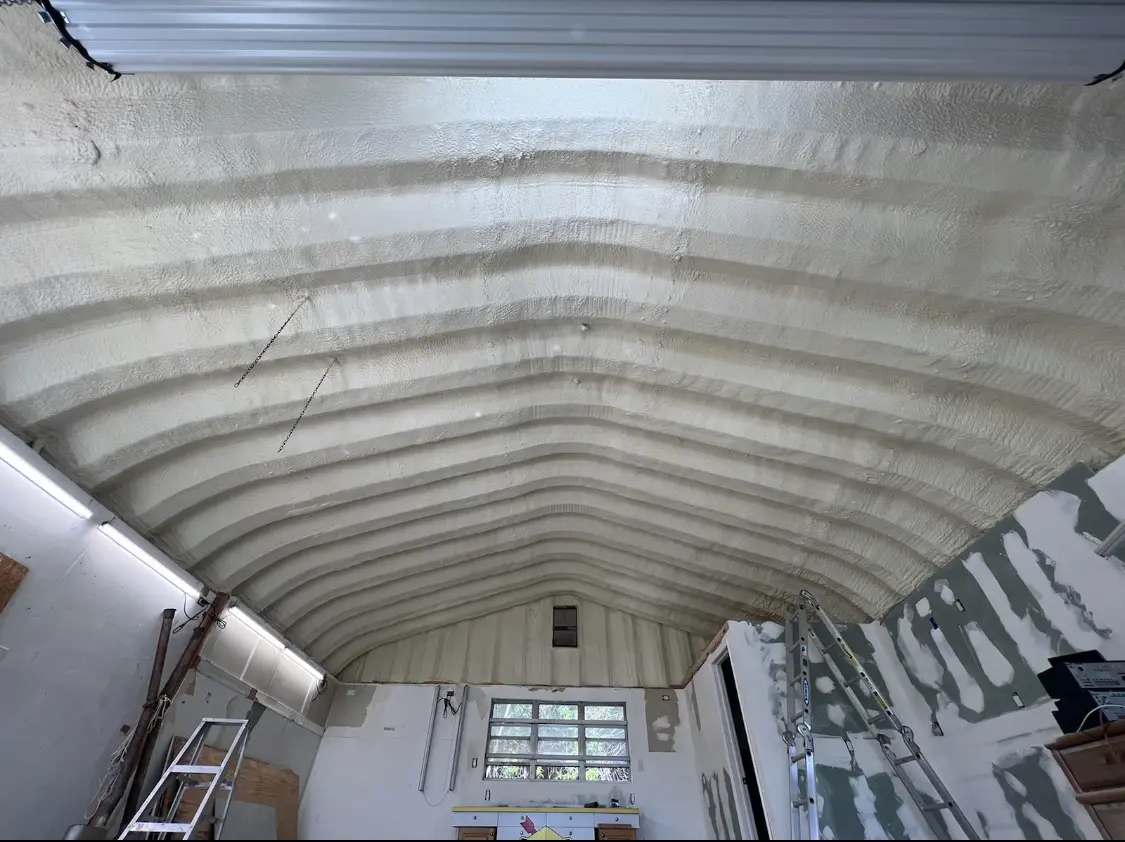 Spray polyurethane foam applied to the underside of a metal roof deck in Waterville